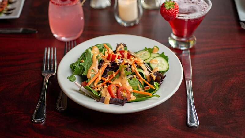 Salad with tomatoes, carrots and cucumbers